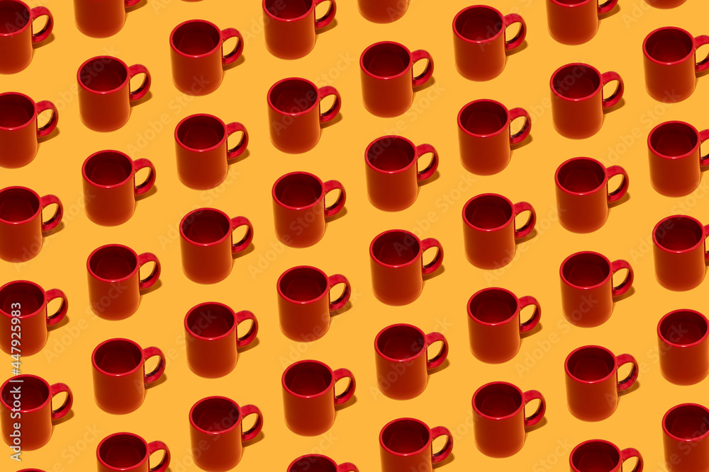 Red coffee mugs on pattern colored studio background Red coffee mugs on pattern colored studio background