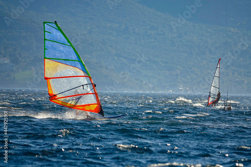 COPY SPACE: Windsurfers explore the Adriatic sea near the Peljesac peninsula. © helivideo