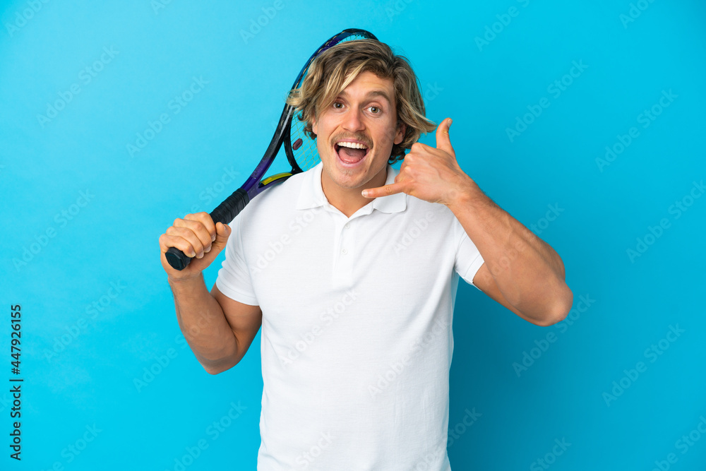 blonde tennis player man isolated on blue background making phone gesture. Call me back sign blonde tennis player man isolated on blue background making phone gesture. Call me back sign