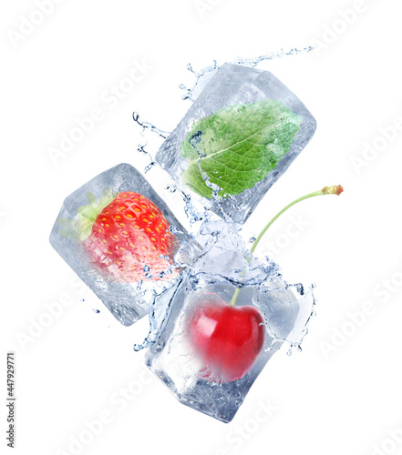 Strawberry, cherry and mint frozen in ice cubes falling on white background