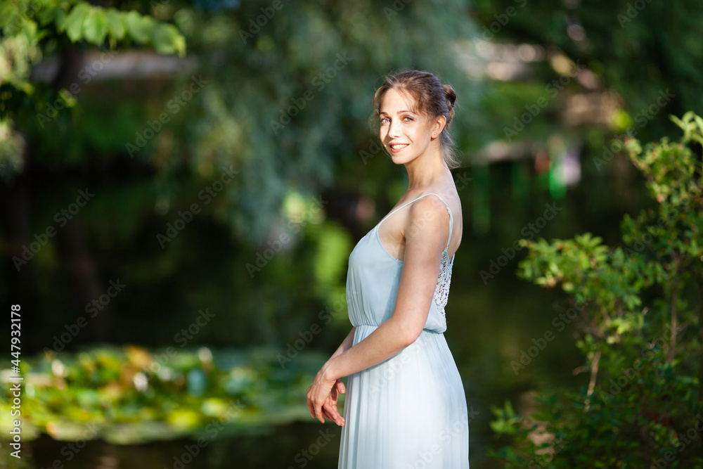 Beautiful young woman in blue dress Beautiful young woman in blue dress