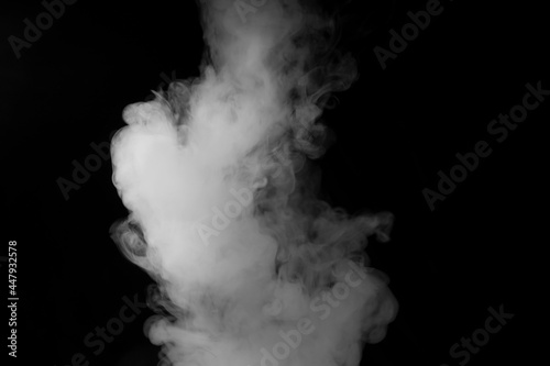 white smoke on black background for overlay effect. a realistic smoke effect for creating an intense nuance in a photo.