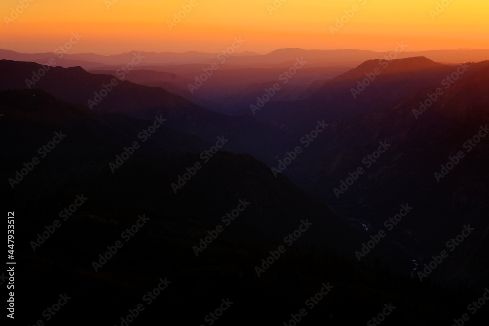 Fototapeta premium Layers of Mountain Ranges in Golden Sunset Light Valleys