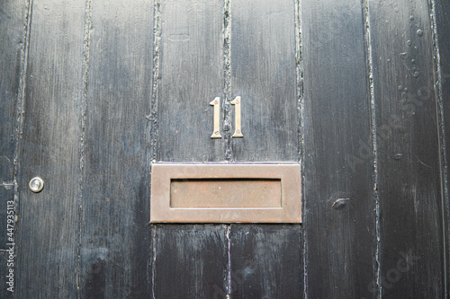 Obraz na płótnie Old letterbox in the door, traditional way of delivering letters to the house, old mailbox, correspondence
w salonie