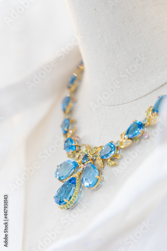 Necklace made of gold and aquamarine, elegant design.