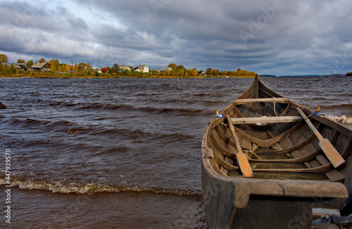 Russia. Republic of Karelia. Boat on the old wooden pier of Lake Vodlozero in the village of Kuganavolok.
