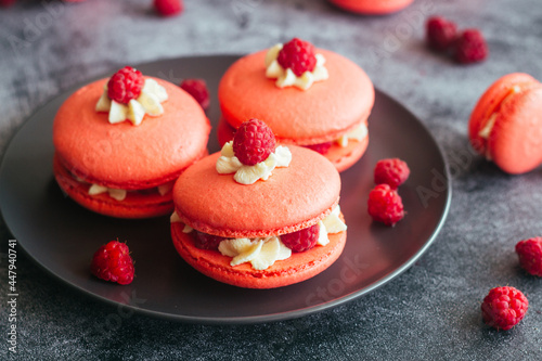 Macaroons. Delicious french desserts. Macaroons with raspberries and cream cheese. Macaroons on the table