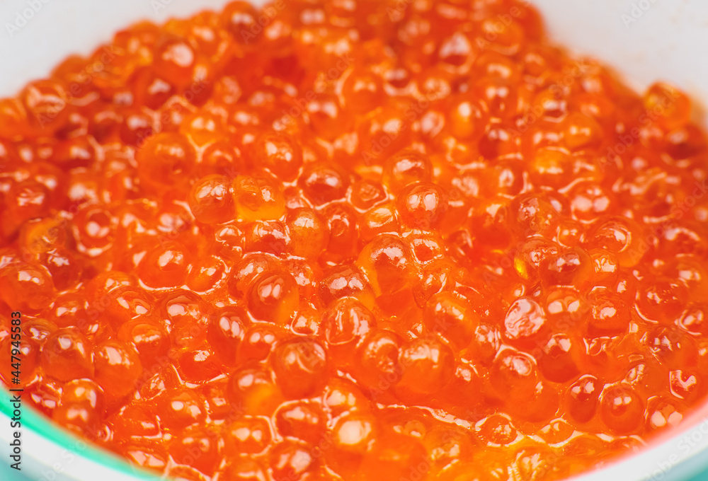Red salmon caviar background. Luxury delicacy seafood. Close up. Red salmon caviar background. Luxury delicacy seafood. Close up.