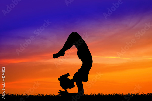 Fototapeta Naklejka Na Ścianę i Meble -  illustration of girl doing yoga pose silhouette at sunset