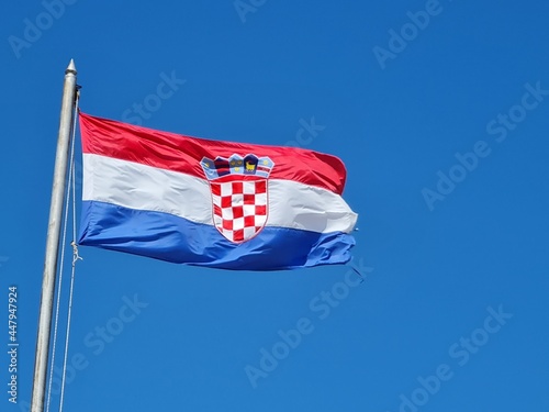 Croatian flag on blue sky. Country flag against sky. Flags of the world