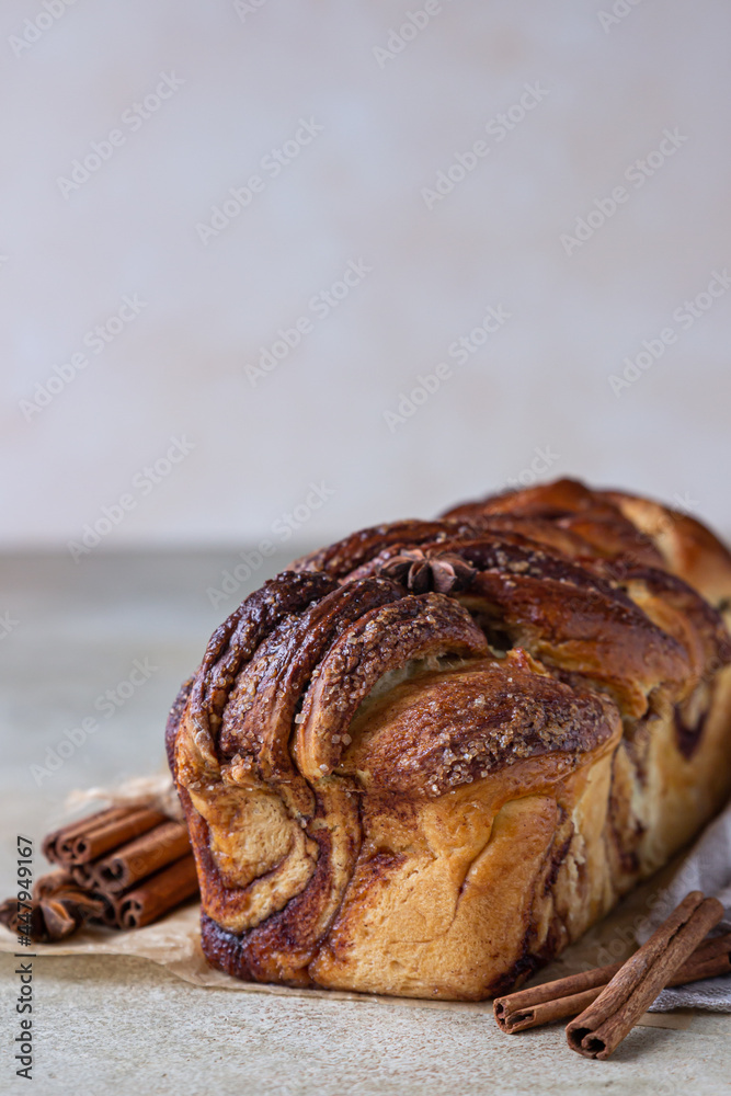 Babka or brioche bread with cinnamon and brown sugar. Homemade pastry for breakfast.