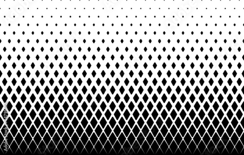 Seamless halftone vector background.Filled with black rhombuses .Rounded corners.