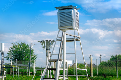 measurement site at a weather station with various meteorological instruments photo