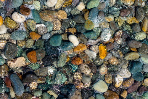 Texture of multi-colored stones on the black sea coast