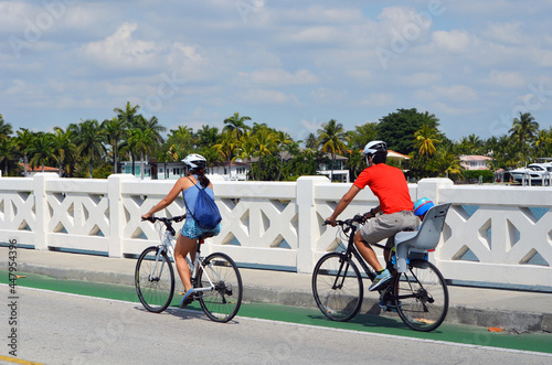 Sunday morning cyclists on the Venetia Causeway in Miami Beach,Florida