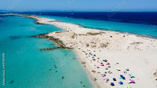 Aerial view of the beaches of Ses Illetes on the island of Formentera in the Balearic Islands, Spain - Turquoise waters on both sides of a sand strip in the Mediterranean Sea