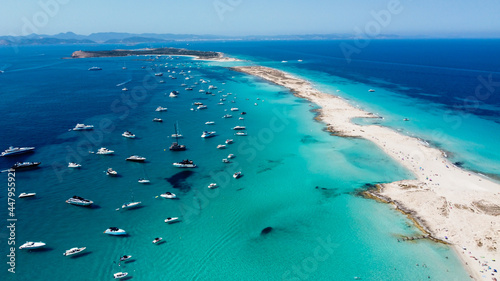 Aerial view of the beaches of Ses Illetes on the island of Formentera in the Balearic Islands, Spain - Turquoise waters on both sides of a sand strip in the Mediterranean Sea photo