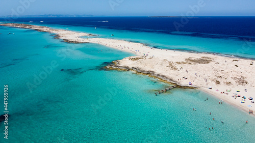 Fototapeta Naklejka Na Ścianę i Meble -  Aerial view of the beaches of Ses Illetes on the island of Formentera in the Balearic Islands, Spain - Turquoise waters on both sides of a sand strip in the Mediterranean Sea