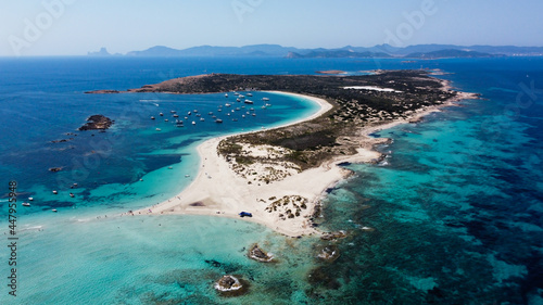 Aerial view of the beaches of Ses Illetes on the island of Formentera in the Balearic Islands, Spain - Turquoise waters on both sides of a sand strip in the Mediterranean Sea