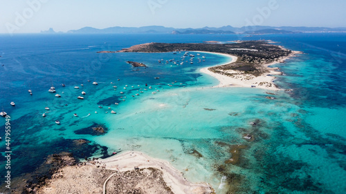 Aerial view of the beaches of Ses Illetes on the island of Formentera in the Balearic Islands, Spain - Turquoise waters on both sides of a sand strip in the Mediterranean Sea