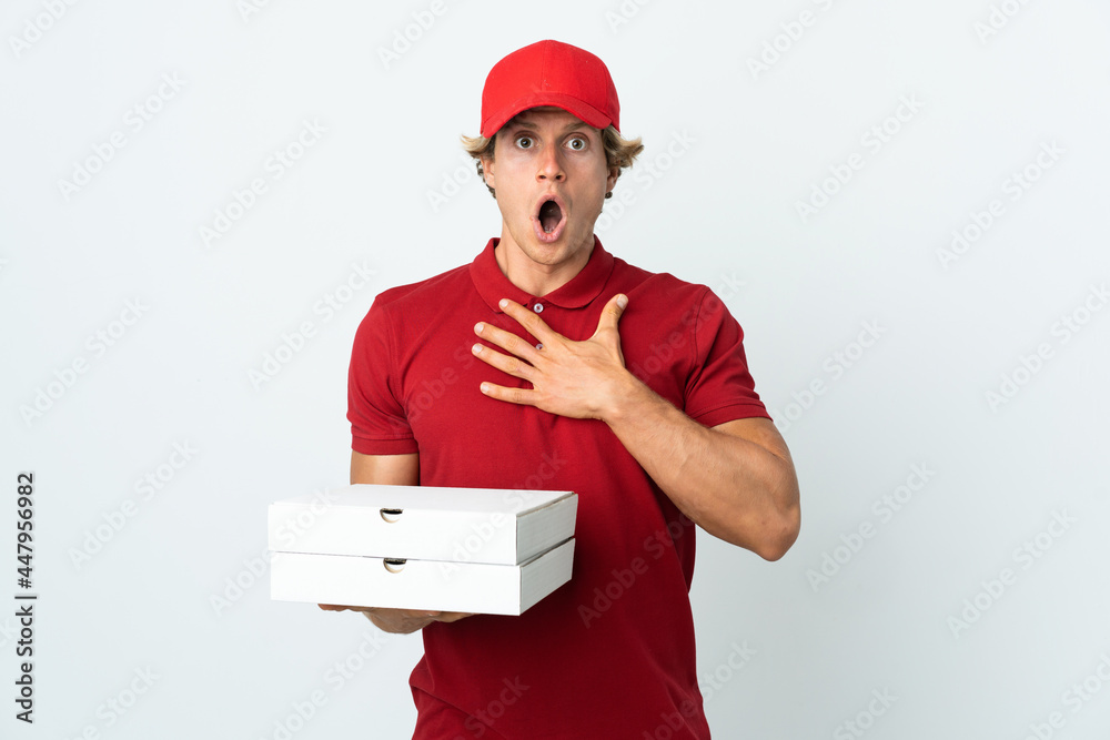 pizza delivery man over isolated white background surprised and shocked while looking right pizza delivery man over isolated white background surprised and shocked while looking right