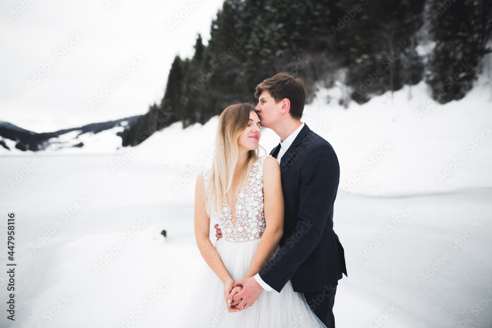 Loving husband and woman on the background of the mountains. Loving couple emotionally spends time Loving husband and woman on the background of the mountains. Loving couple emotionally spends time
