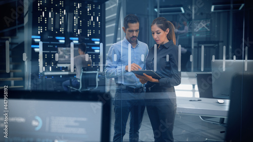 Fotografía Female and Male Engineers Analyzing Data on Futuristic Transparent Touch Screen