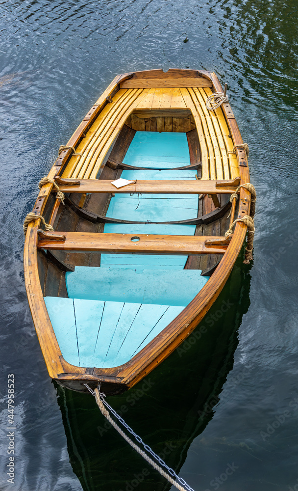 Wooden boat in combination natural color and blue color