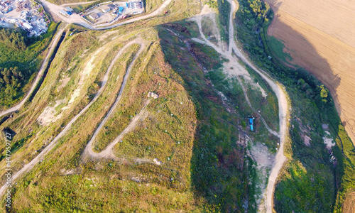 Aerial view of a large green hill in the fields. Ecology pollution garbage landfill © Payllik