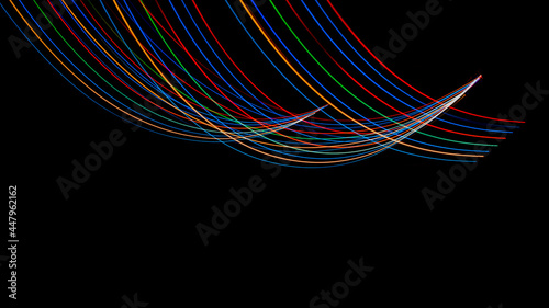 Luminous multicolored wavy lines rainbow on a black background © Remigiusz