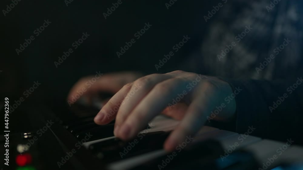 Man composing new song in recording studio. Man composing new song in recording studio.
