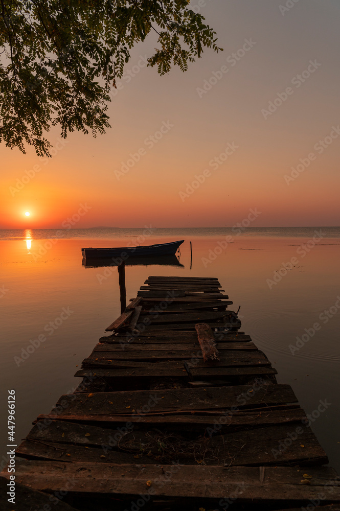 sunrise with old wooden boats