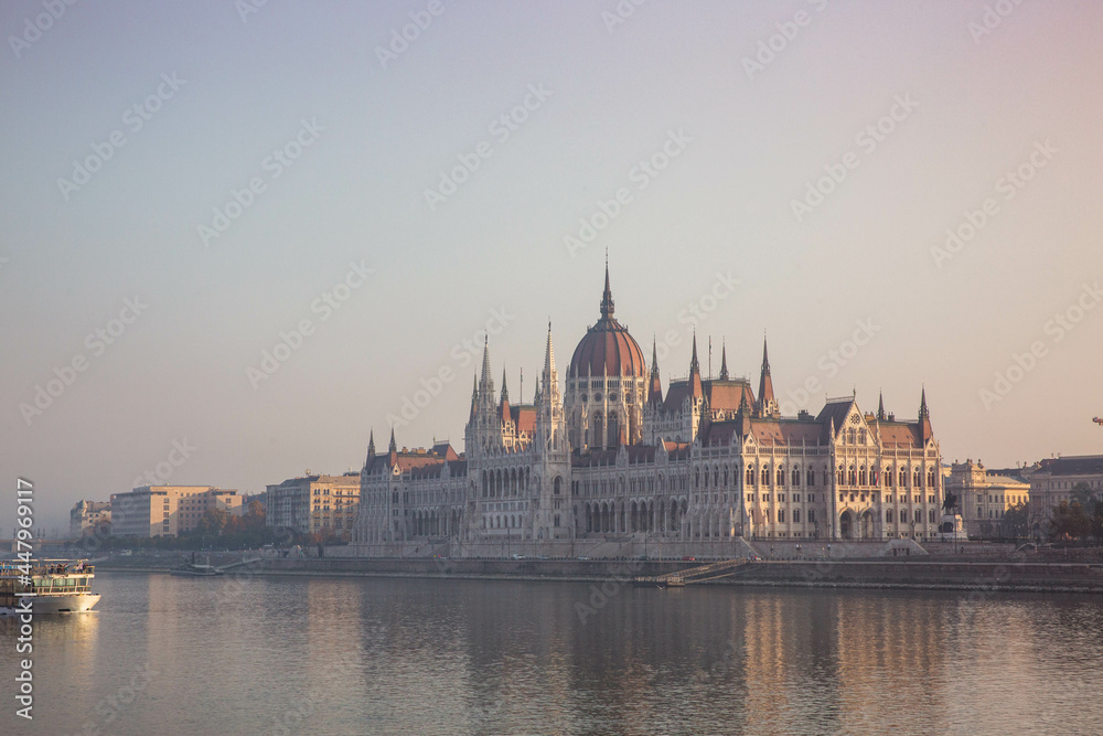 Hungarian parliament building in fog at sunrise in Budapest
