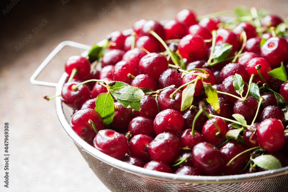 Cherries in a steel sieve. top view, texture Cherries in a steel sieve. top view, texture