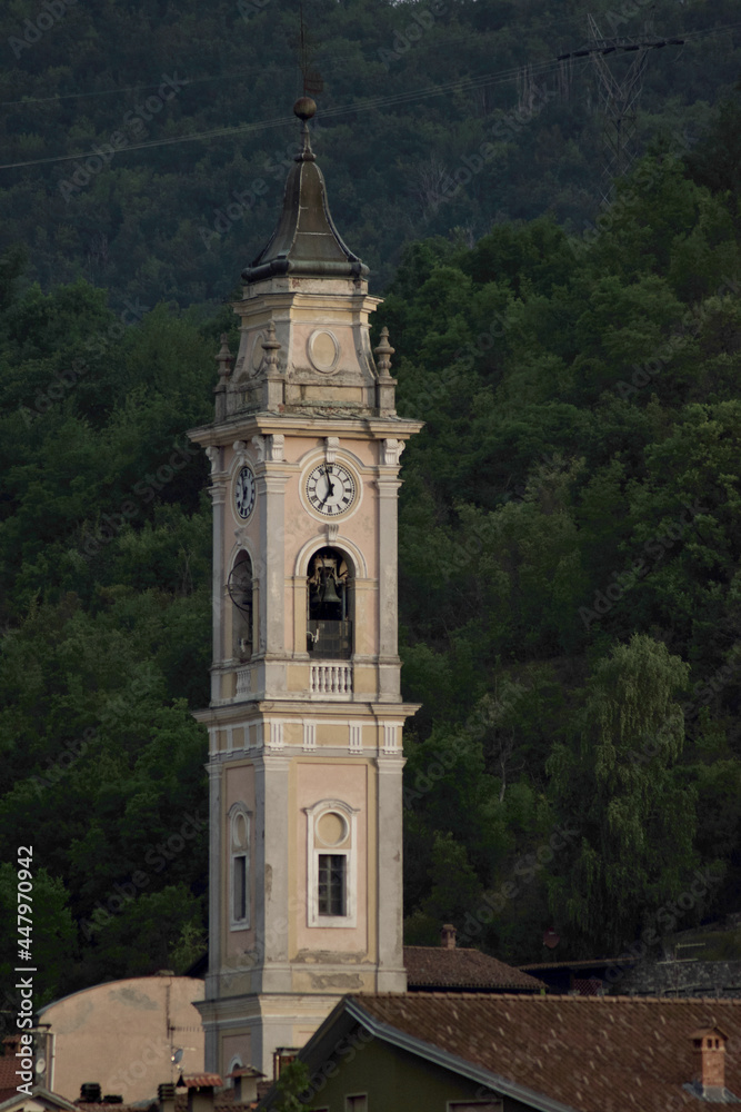 old bell tower with clock of a Catholic church