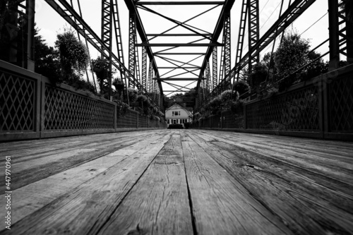 Drake Hill Flower Bridge Simsbury Connecticut. Black and white photo of iron bridge with wooden planks.
