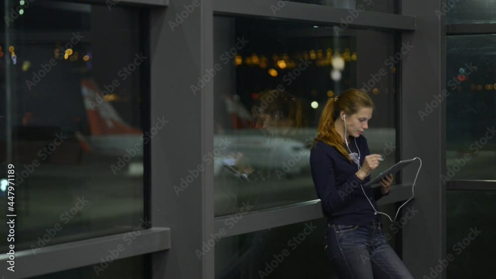 Wasting time during passenger delay woman uses videochat