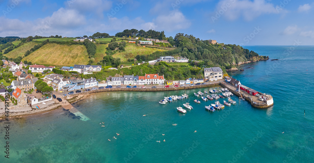 Panoramic image of Rozel Harbour at high tide with surrounding countryside.