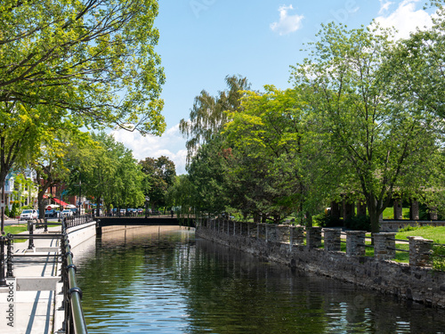 Lachine canal water scenic view of environmental friendly suburbia rich in green trees. Lachine, Quebec, Canada