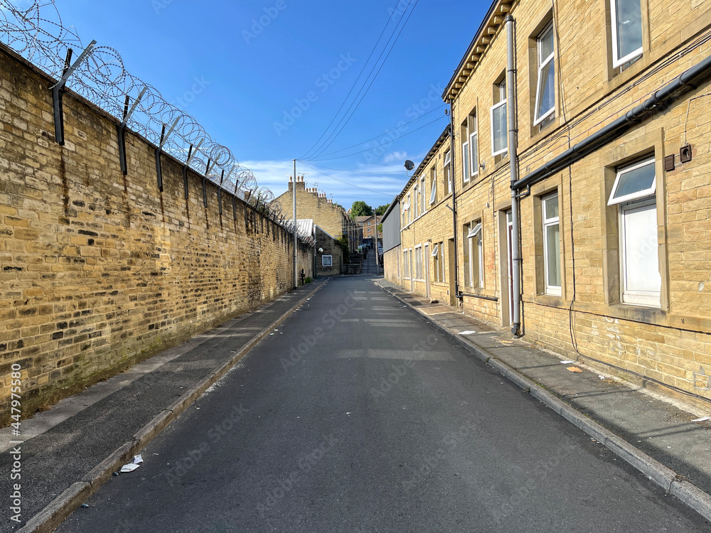 View along, Fearnside Street, with sandstone walls, and cottages, in the post industrial city of, Bradford, Yorkshire, UK View along, Fearnside Street, with sandstone walls, and cottages, in the post industrial city of, Bradford, Yorkshire, UK