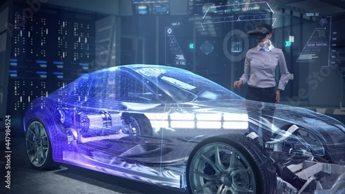 Automotive Female Professional Engineer working on design of Electric Car using Futuristic Augmented Reality Headset with Holographic Technology at High-tech facility. Electric car chassis.