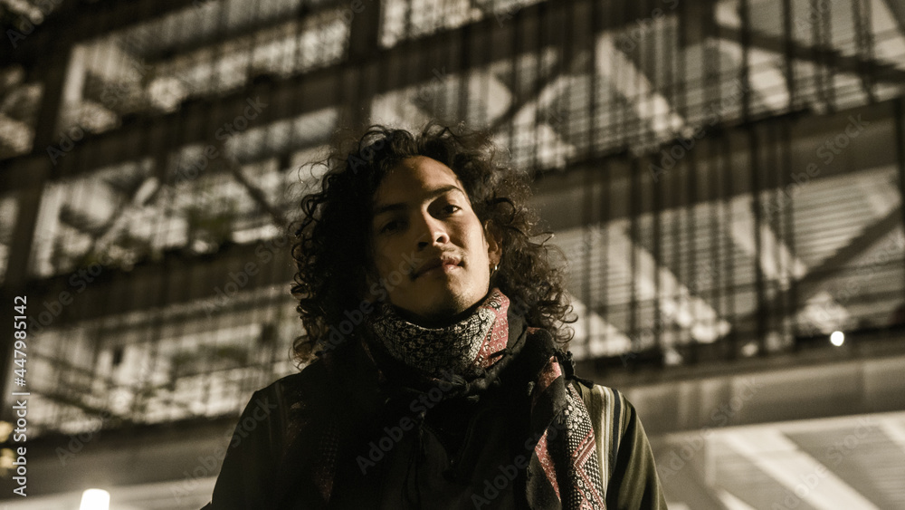 young latin model with long hair and scarf smiles young latin model with long hair and scarf smiles