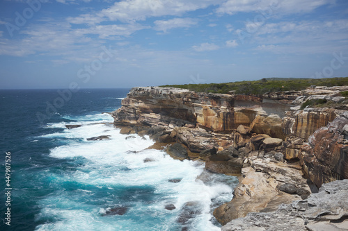 Waves crashing against cliffs