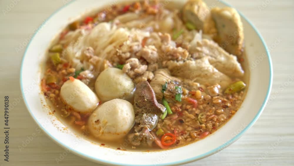 noodles with pork and meatballs in spicy soup or Tom yum noodles in Asian style noodles with pork and meatballs in spicy soup or Tom yum noodles in Asian style