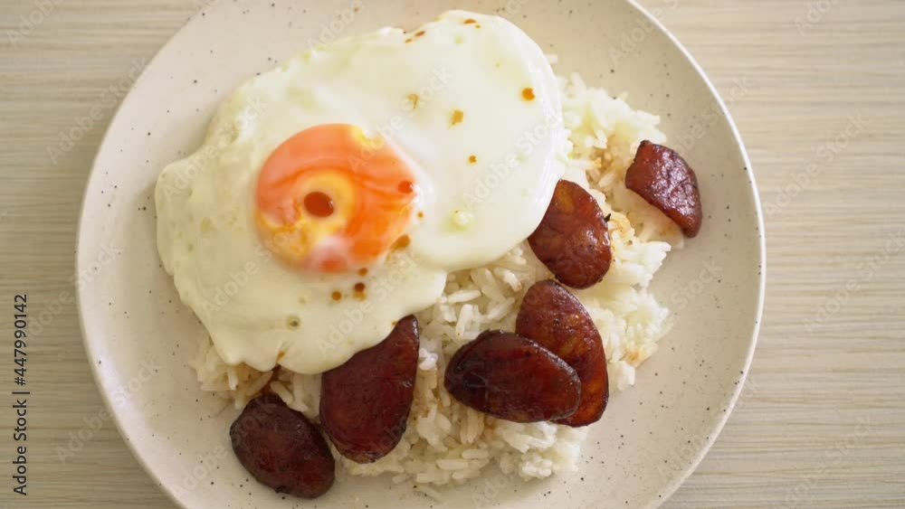 rice with fried egg and Chinese sausage - Homemade food in Asian style rice with fried egg and Chinese sausage - Homemade food in Asian style