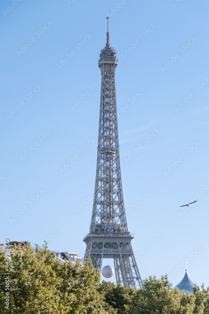 downtown paris with the eiffel tower during a sunny day