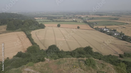 Farmland Revealed Rock Of Dunamase At Lush Vegetation Hilltop In Dunamaise, Ireland. - Aerial Overhead Shot photo