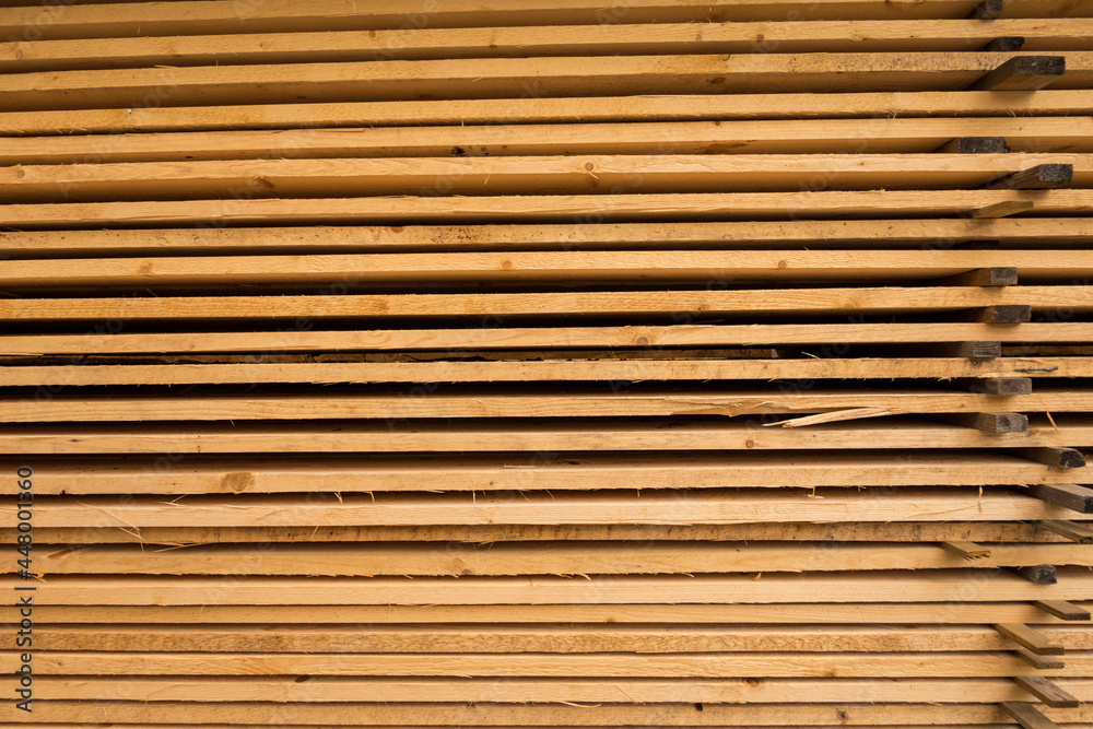 Hofsnas, Sweden Piles of fresh timber piled high waiting for a siding job. Hofsnas, Sweden Piles of fresh timber piled high waiting for a siding job.