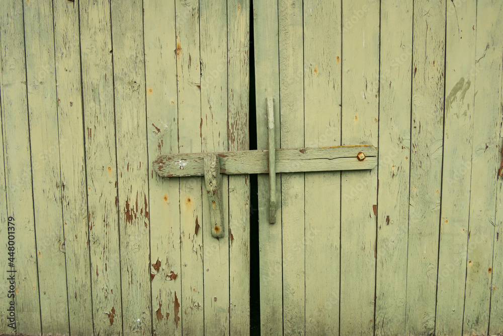 Hofsnas, Sweden Architectural details from a farm. A green door and latch. Hofsnas, Sweden Architectural details from a farm. A green door and latch.