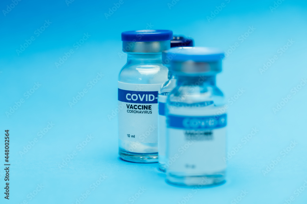 Glass bottles of covid-19 vaccine contains 10 milliliters each dose prepared at clinic before injecting volunteer as immunity activation for people to prevent pathogen outbreak. Glass bottles of covid-19 vaccine contains 10 milliliters each dose prepared at clinic before injecting volunteer as immunity activation for people to prevent pathogen outbreak.